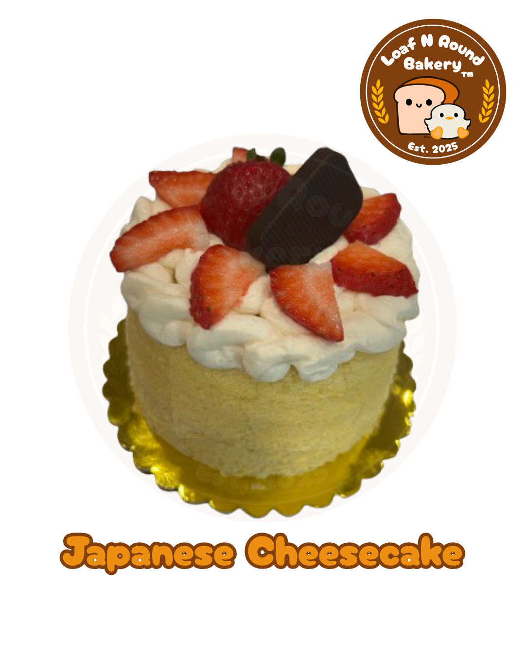 A decorated Japanese cheesecake from Loaf N Round Bakery, topped with whipped cream, fresh strawberries, a chocolate piece, displayed on a gold scalloped base against a white background with the bakery logo and 'Japanese Cheesecake' text.